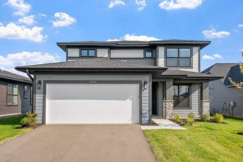 a house with a white garage door in front of it